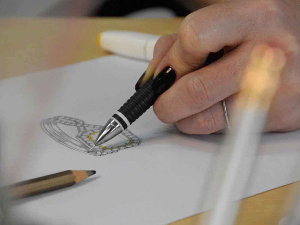 Emma Gregory sketching a design in the Bangkok Bespoke Jewelry studio